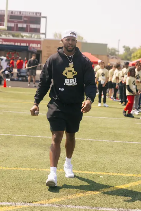 Coach on the field during an outdoor football session