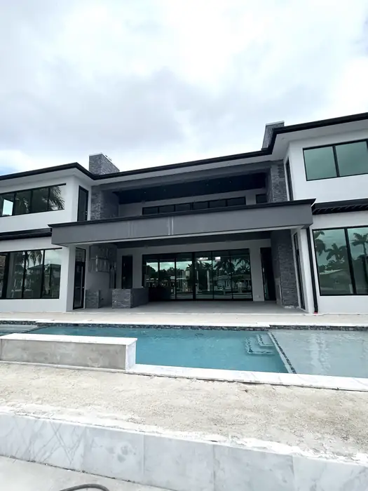 Contemporary South Florida property with pool at dusk