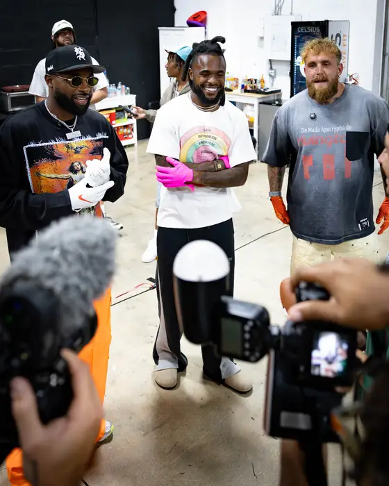 Athlete speaking with press as photographers capture the moment